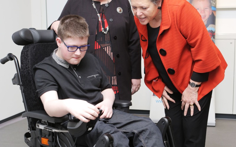 Christopher Anderson showing Baroness Kramer his new wheelchair