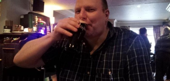 Doug Paulley drinking a pint of beer