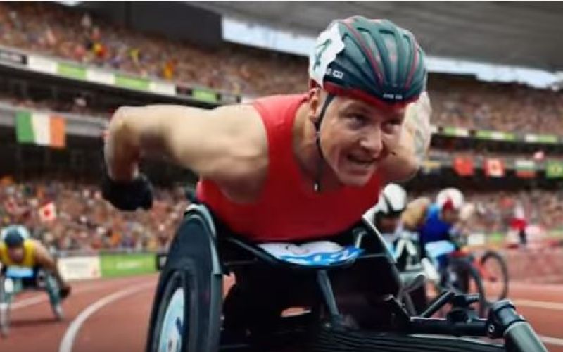 Wheelchair-racer David Weir racing round a bend on the track