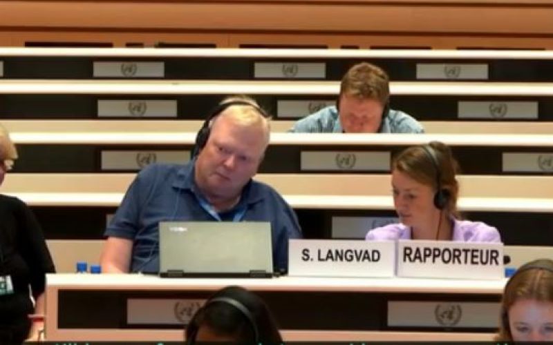 Stig Langvad sits with headphones on in UN debating chamber