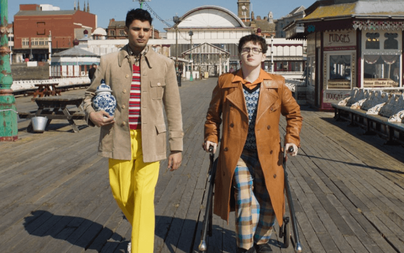 Jack Carroll and another actor walk towards the camera