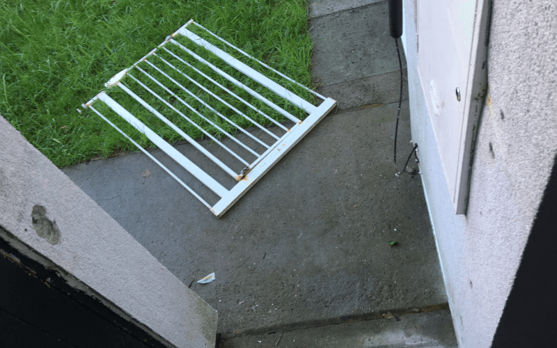 A metal gate lying on the ground