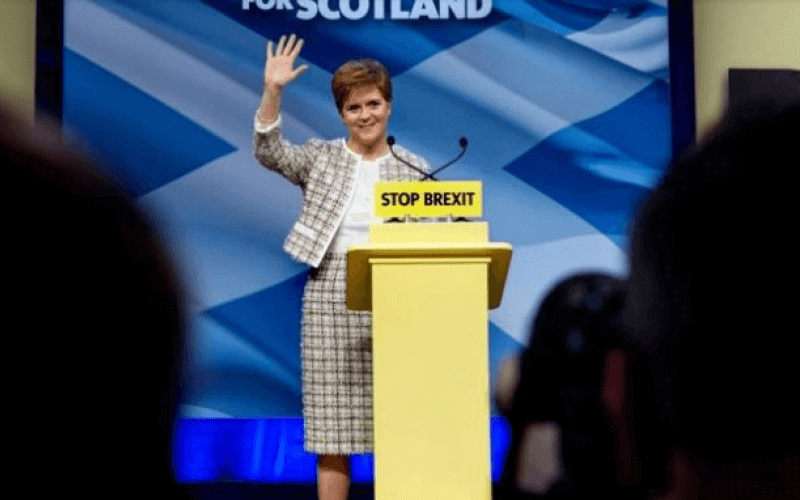 Nicola Sturgeon behind a podium