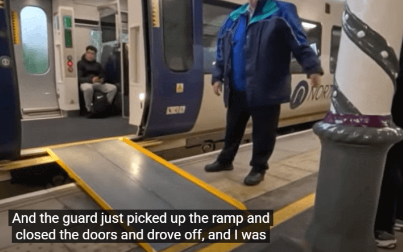 An open door to a rail carriage, with a portable ramp leading down to the platform. The ramp ends just a few inches in front of a pillar, while a rail staff member looks on. At the bottom are the words: 'And the guard just picked up the ramp and closed the doors and drove off, and I was...'